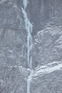 Climber doing ice climbing in Bodo, Nordland, Norway Climber doing ice climbing in Bodo, Nordland, Norway